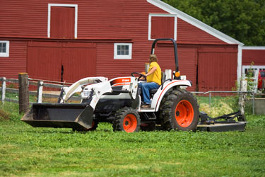 Bobcat_CT450_with_bucket_and_rotary_cutter