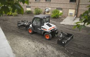 Toolcat 5610 with box blade and soil conditioner